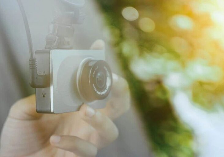 A person holding a camera in their hand.